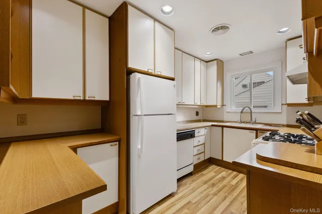 a view of an empty room with windows and city view