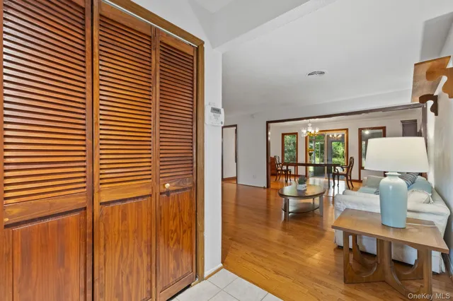 a dining room with furniture and wooden floor