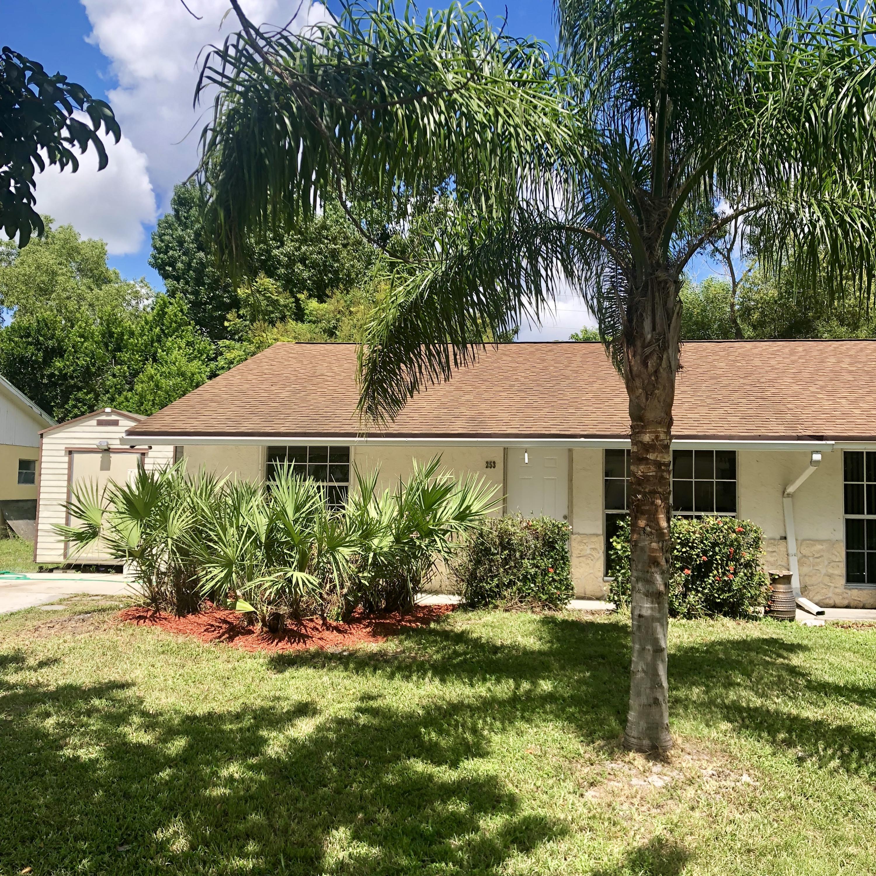 front view of a house with a yard