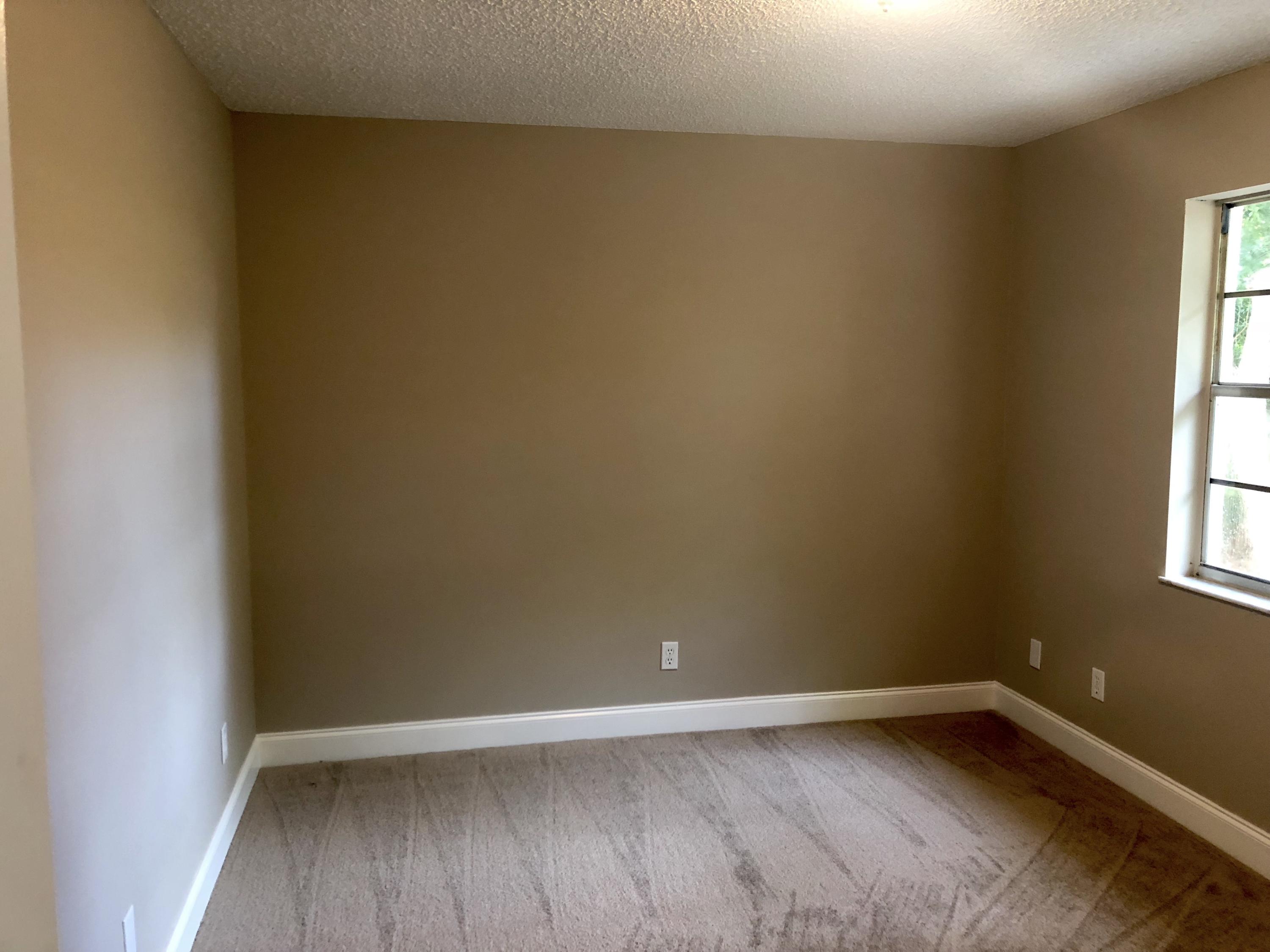 253 Southeast Norfolk Boulevard Stuart, FL 34997 - Photo 9 of 16 a view of an empty room and window