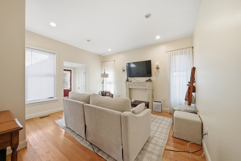 48-50 Carleton Street Newton, MA 02458 - Photo 12 of 19 a living room with furniture and a flat screen tv