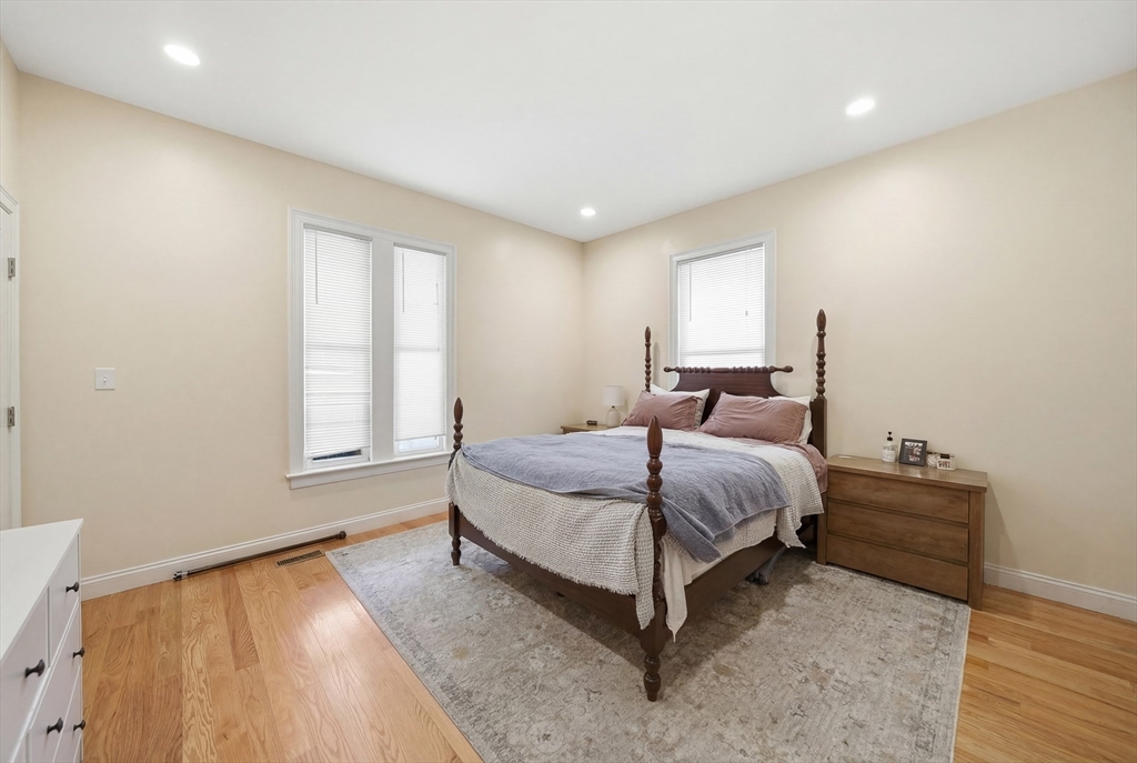 48-50 Carleton Street Newton, MA 02458 - Photo 17 of 19 a spacious bedroom with a bed and window