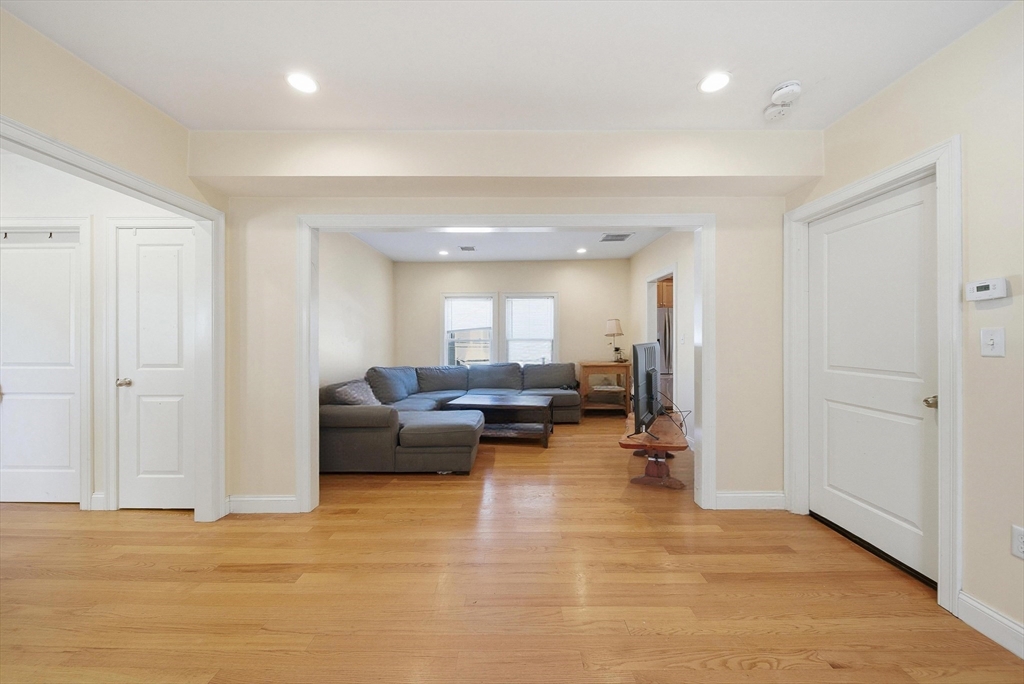48-50 Carleton Street Newton, MA 02458 - Photo 4 of 19 a living room with furniture and a wooden floor