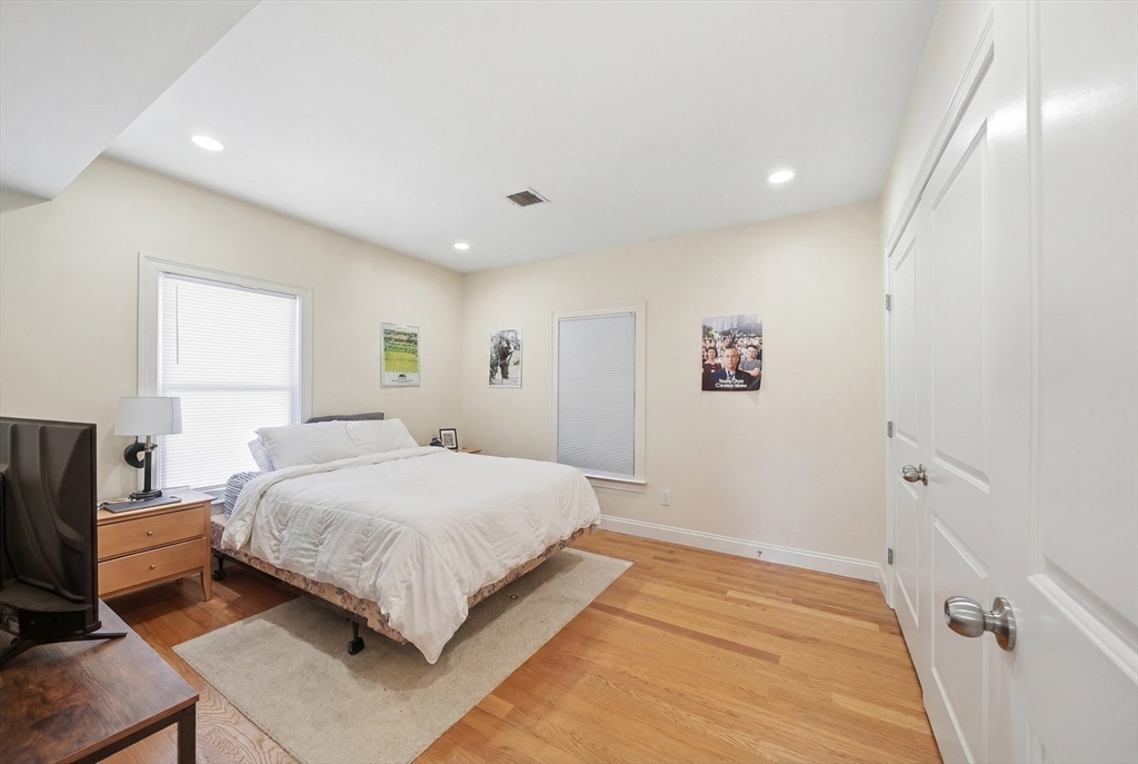 48-50 Carleton Street Newton, MA 02458 - Photo 5 of 19 a bedroom with a large bed and a window