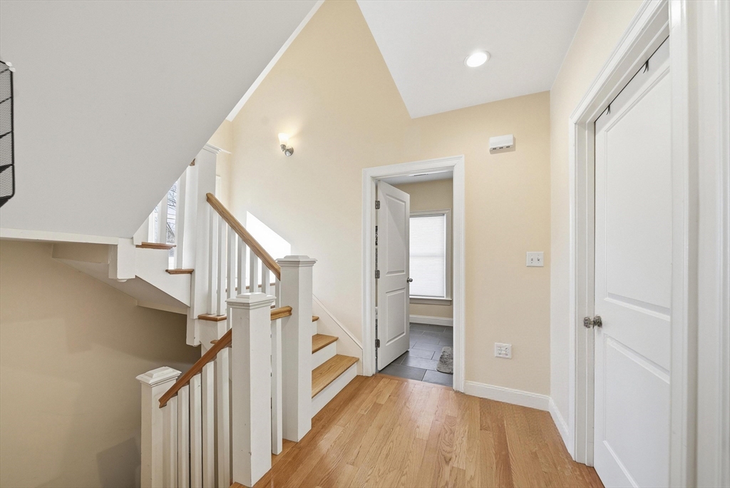 48-50 Carleton Street Newton, MA 02458 - Photo 6 of 19 a view of entryway with wooden floor