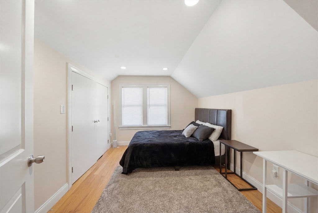 48-50 Carleton Street Newton, MA 02458 - Photo 7 of 19 a bedroom with a bed and a window