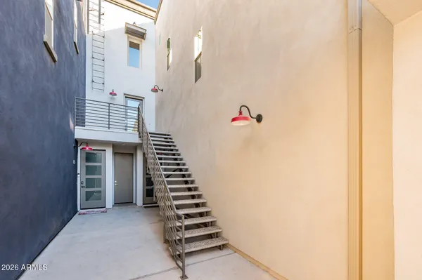 a terrace with outdoor seating and city view