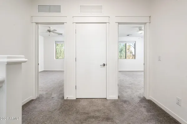 a view of an entryway with wooden floor