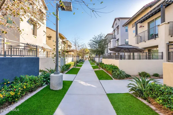 a view of a pathway with house on both side