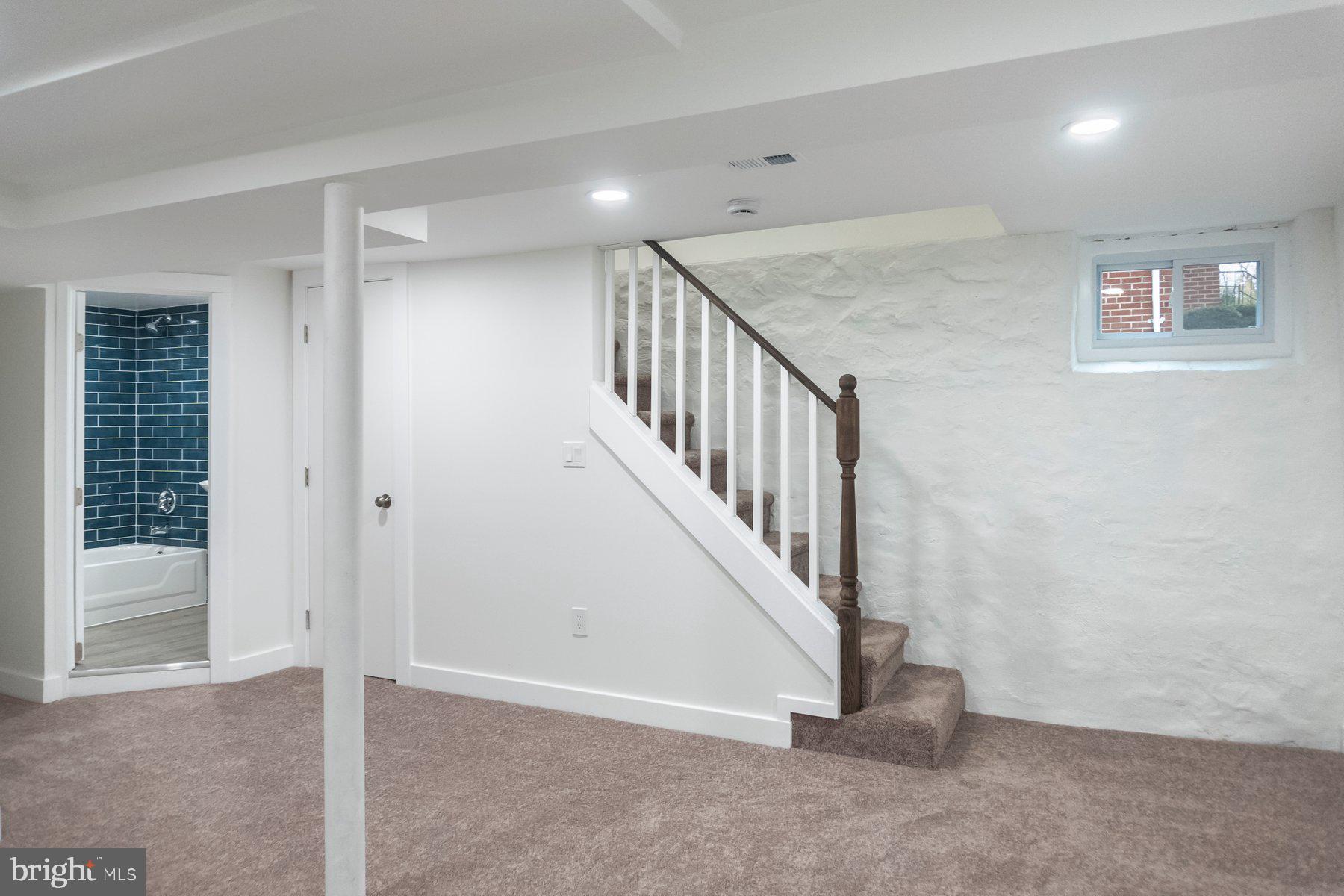 5216 Biddison Lane Baltimore, MD 21206 - Photo 19 of 32 a view of an entryway with stairs