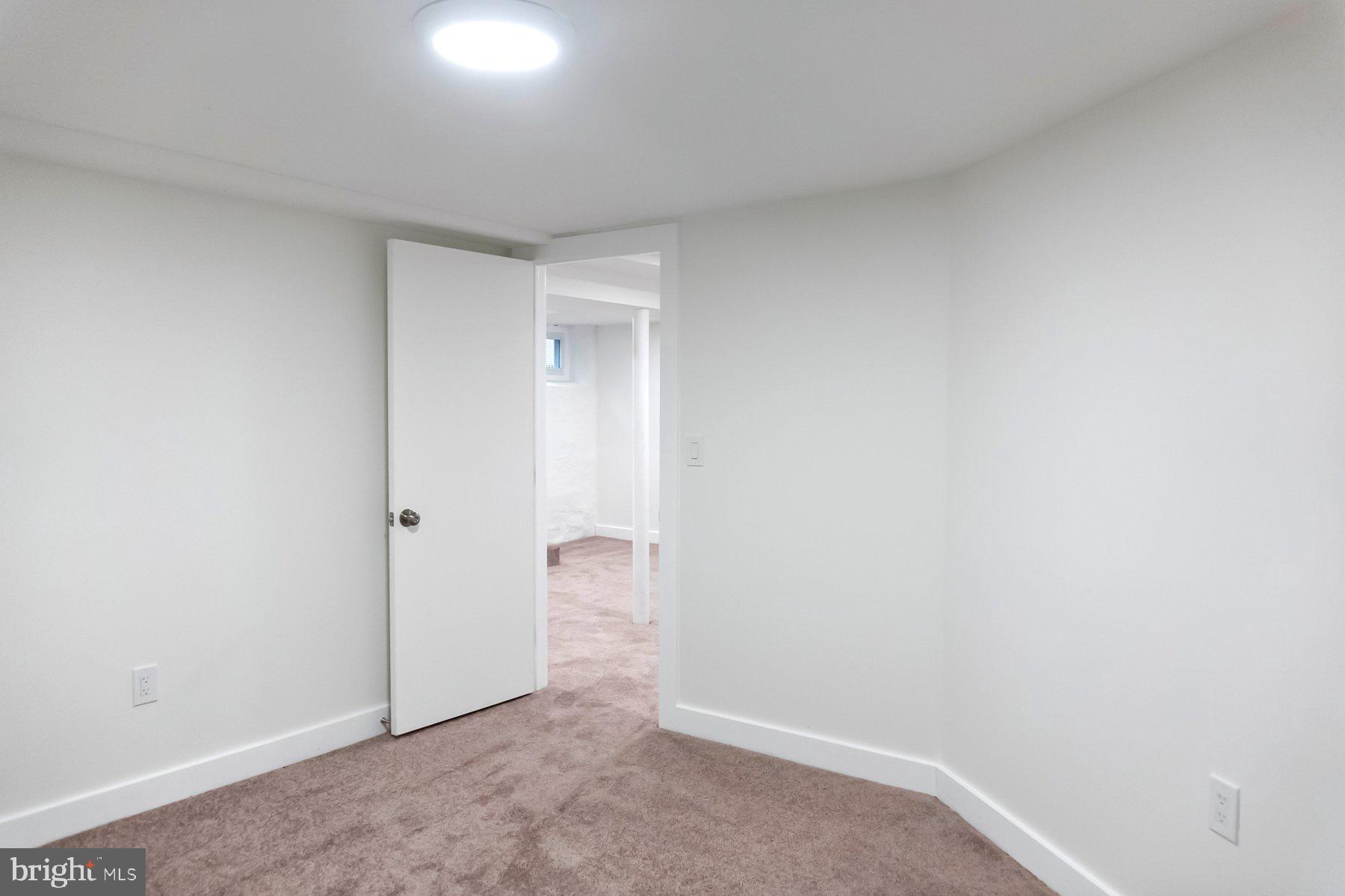 5216 Biddison Lane Baltimore, MD 21206 - Photo 22 of 32 a view of an empty room