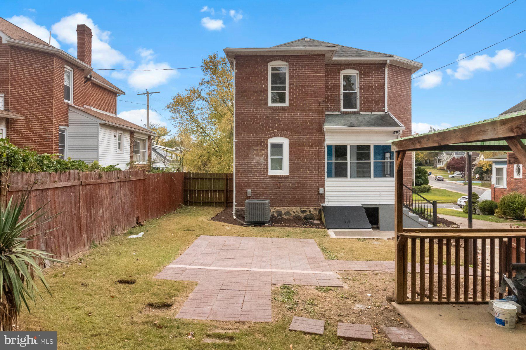 5216 Biddison Lane Baltimore, MD 21206 - Photo 24 of 32 a front view of a house with a yard