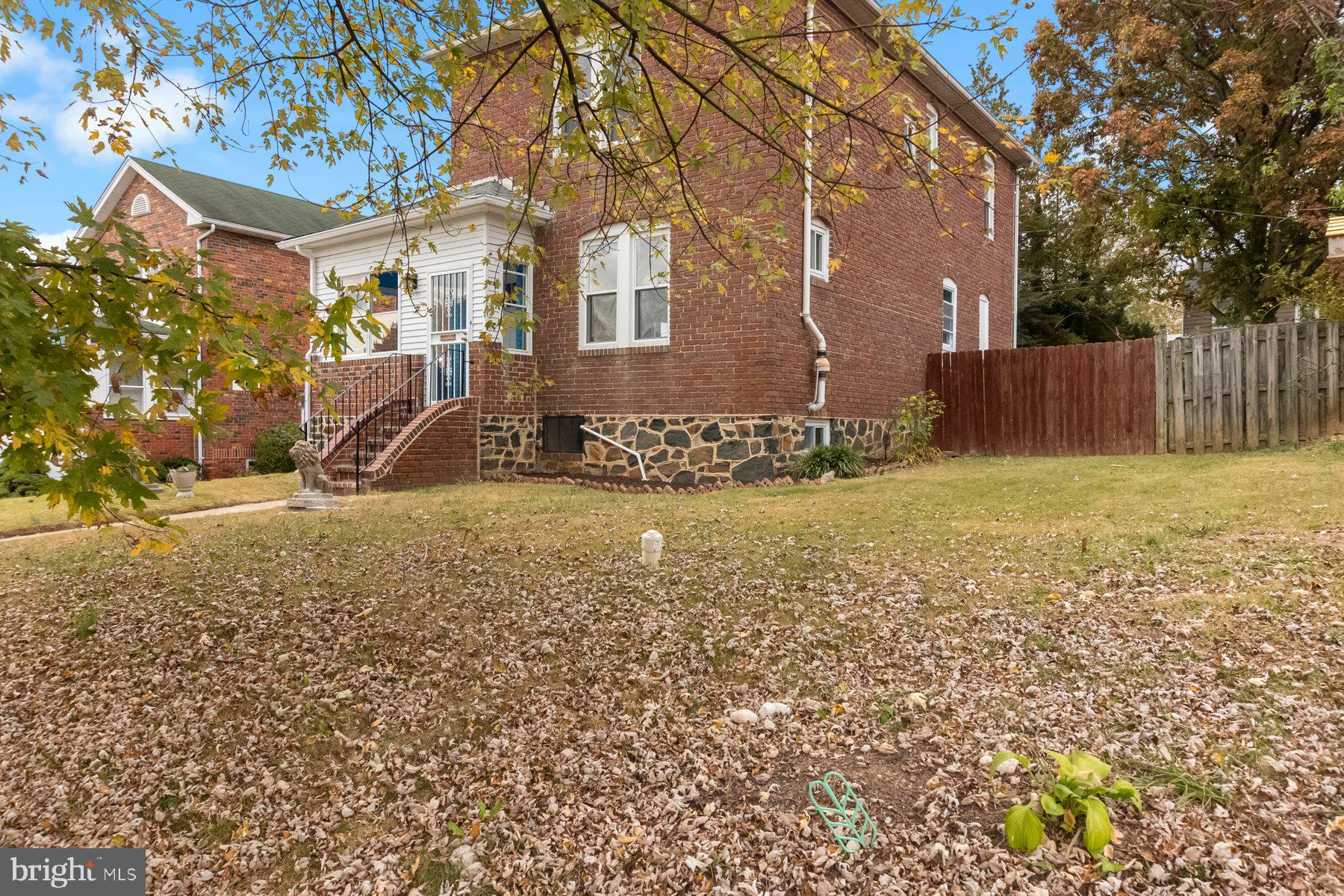 5216 Biddison Lane Baltimore, MD 21206 - Photo 28 of 32 a view of a house with a yard
