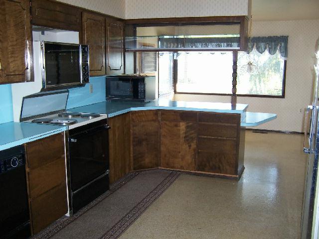 251 Phipps Road Outlook, WA 98938 - Photo 2 of 6 a kitchen with stainless steel appliances a stove sink and microwave