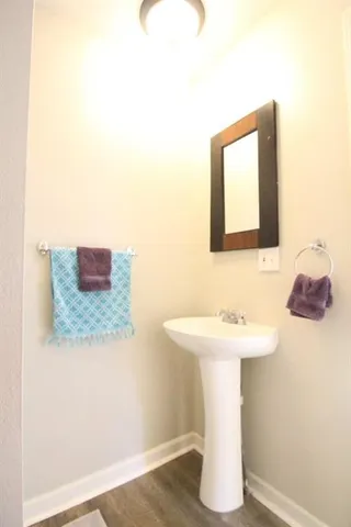 a bathroom with a sink and mirror