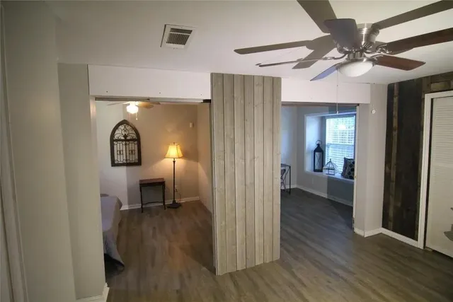 a view of a livingroom from a hallway