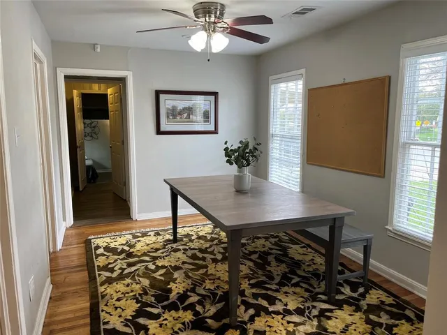 a view of a workspace with furniture and window
