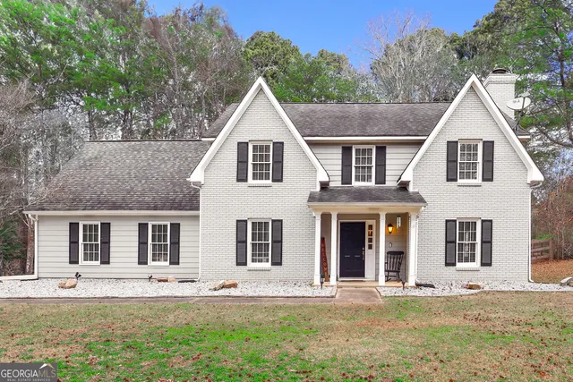 front view of a house with a yard