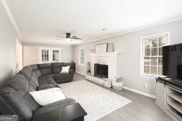 a living room with furniture and a flat screen tv