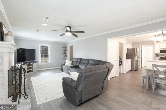 a large kitchen with a table and chairs