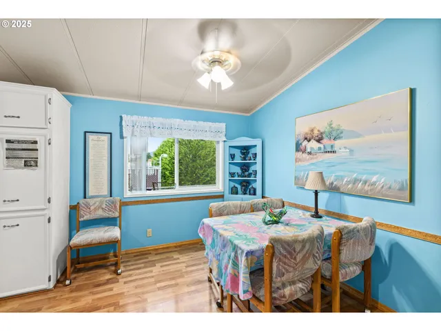 a dining room with a table and chairs