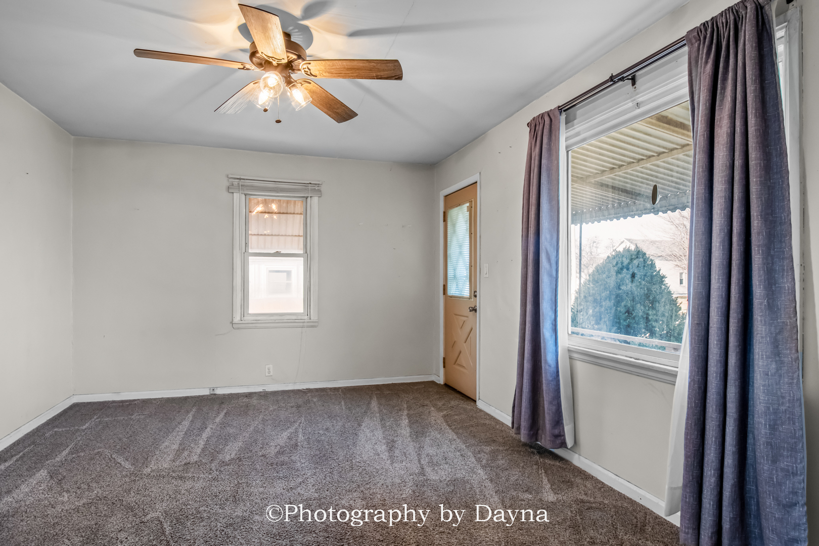 317 Thomas Street Martinton, IL 60951 - Photo 2 of 22 a view of a big room with wooden floor and a chandelier fan