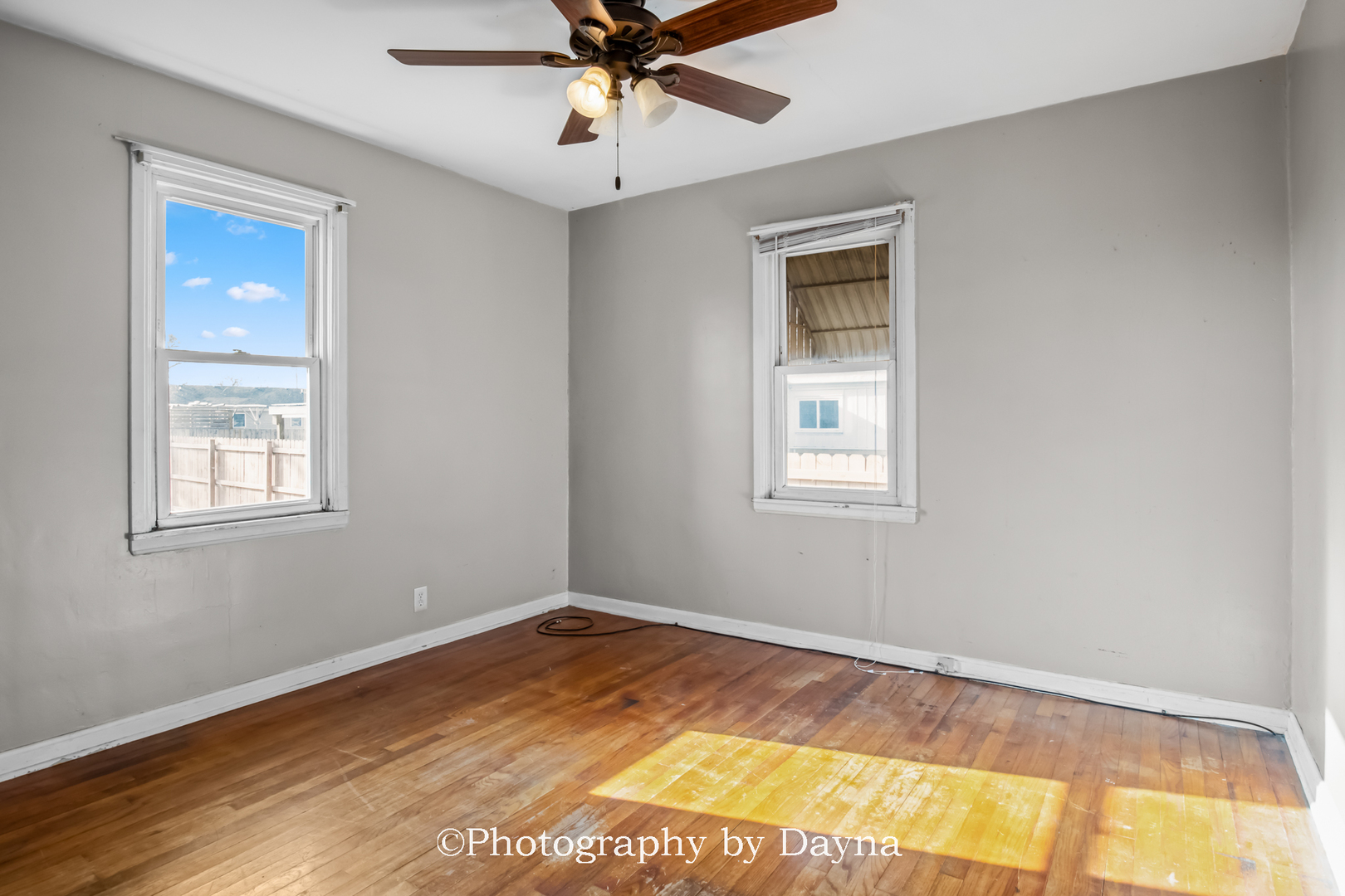 317 Thomas Street Martinton, IL 60951 - Photo 6 of 22 a view of a room with wooden floor and windows