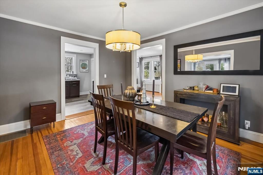 138 Chestnut Ridge Road Saddle River, NJ 07458 - Photo 11 of 31 a view of a dining room with furniture a chandelier and wooden floor