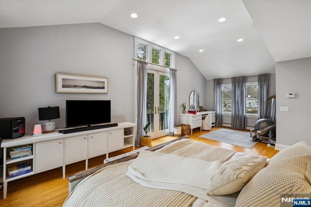 138 Chestnut Ridge Road Saddle River, NJ 07458 - Photo 12 of 31 a bedroom with a bed and flat screen tv