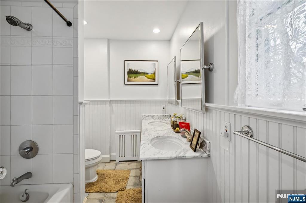 138 Chestnut Ridge Road Saddle River, NJ 07458 - Photo 15 of 31 a bathroom with a sink and a shower curtain