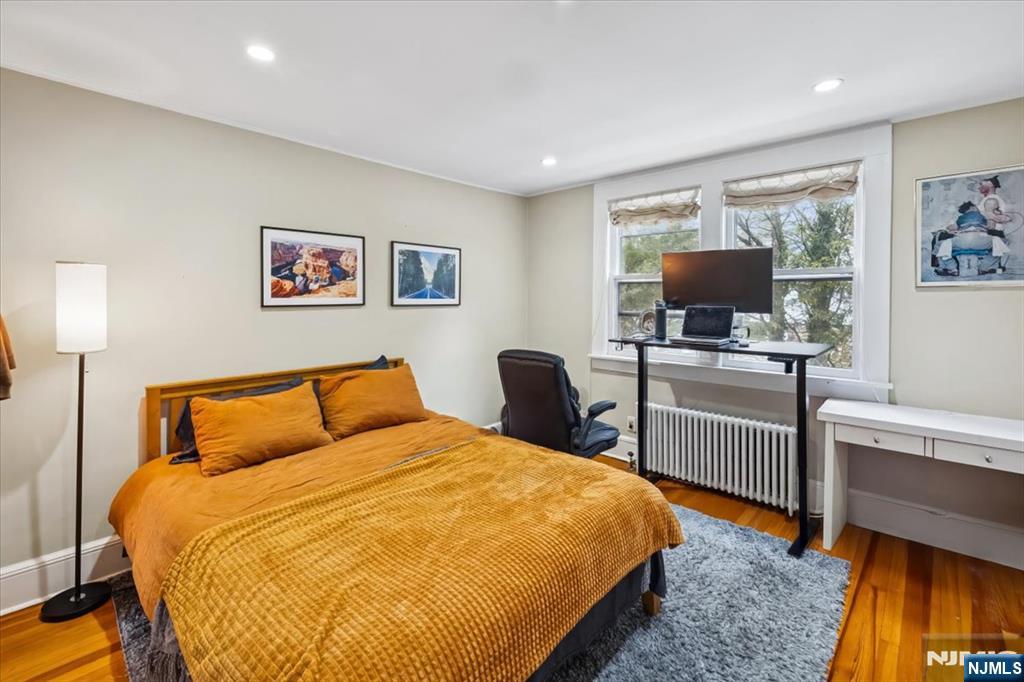 138 Chestnut Ridge Road Saddle River, NJ 07458 - Photo 16 of 31 a bedroom with a bed and a flat screen tv