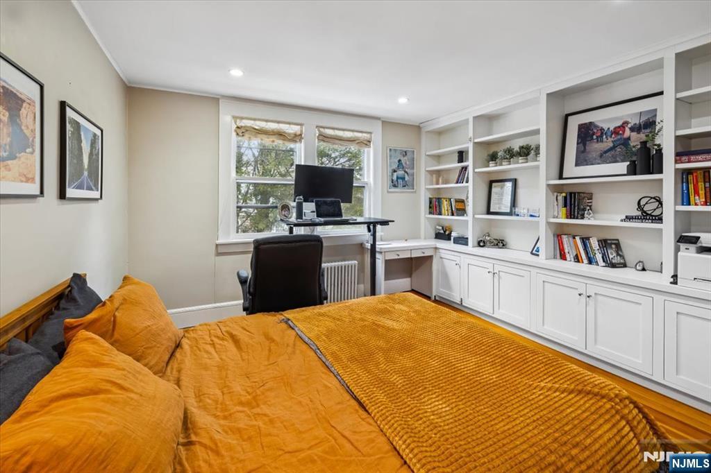 138 Chestnut Ridge Road Saddle River, NJ 07458 - Photo 17 of 31 a bed room with a bed and a flat screen tv