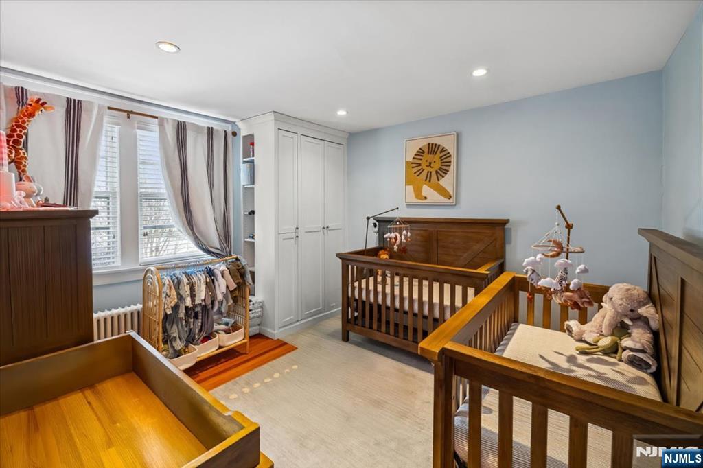 138 Chestnut Ridge Road Saddle River, NJ 07458 - Photo 18 of 31 a bedroom with furniture and a window