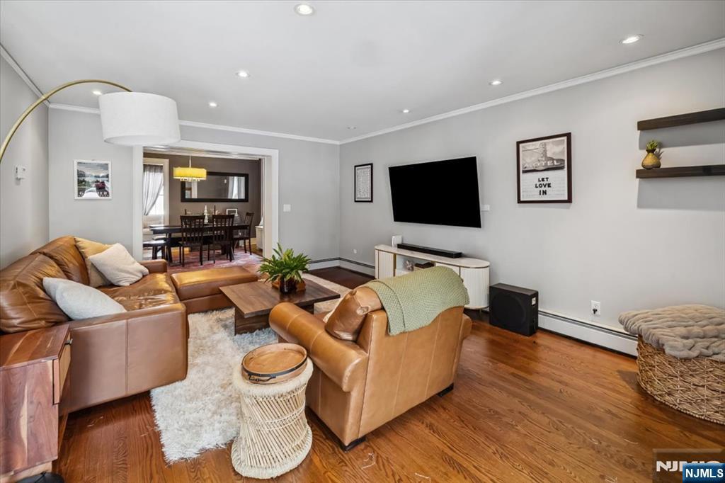 138 Chestnut Ridge Road Saddle River, NJ 07458 - Photo 3 of 31 a living room with furniture and a flat screen tv