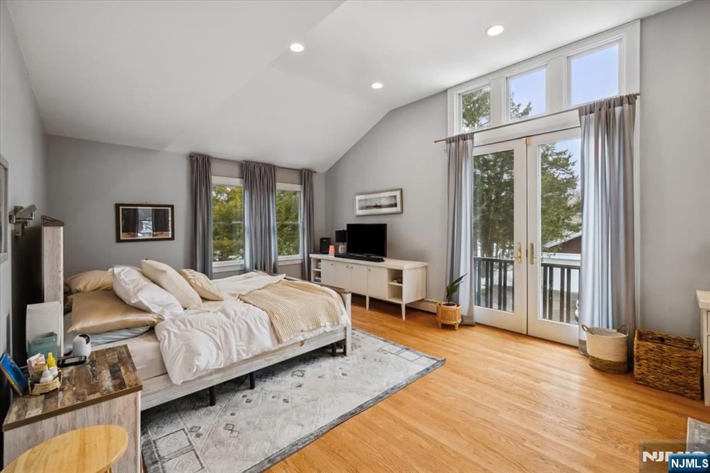 138 Chestnut Ridge Road Saddle River, NJ 07458 - Photo 9 of 31 a bedroom with bed and large windows