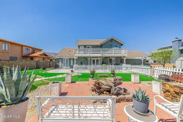 an aerial view of residential houses and outdoor space