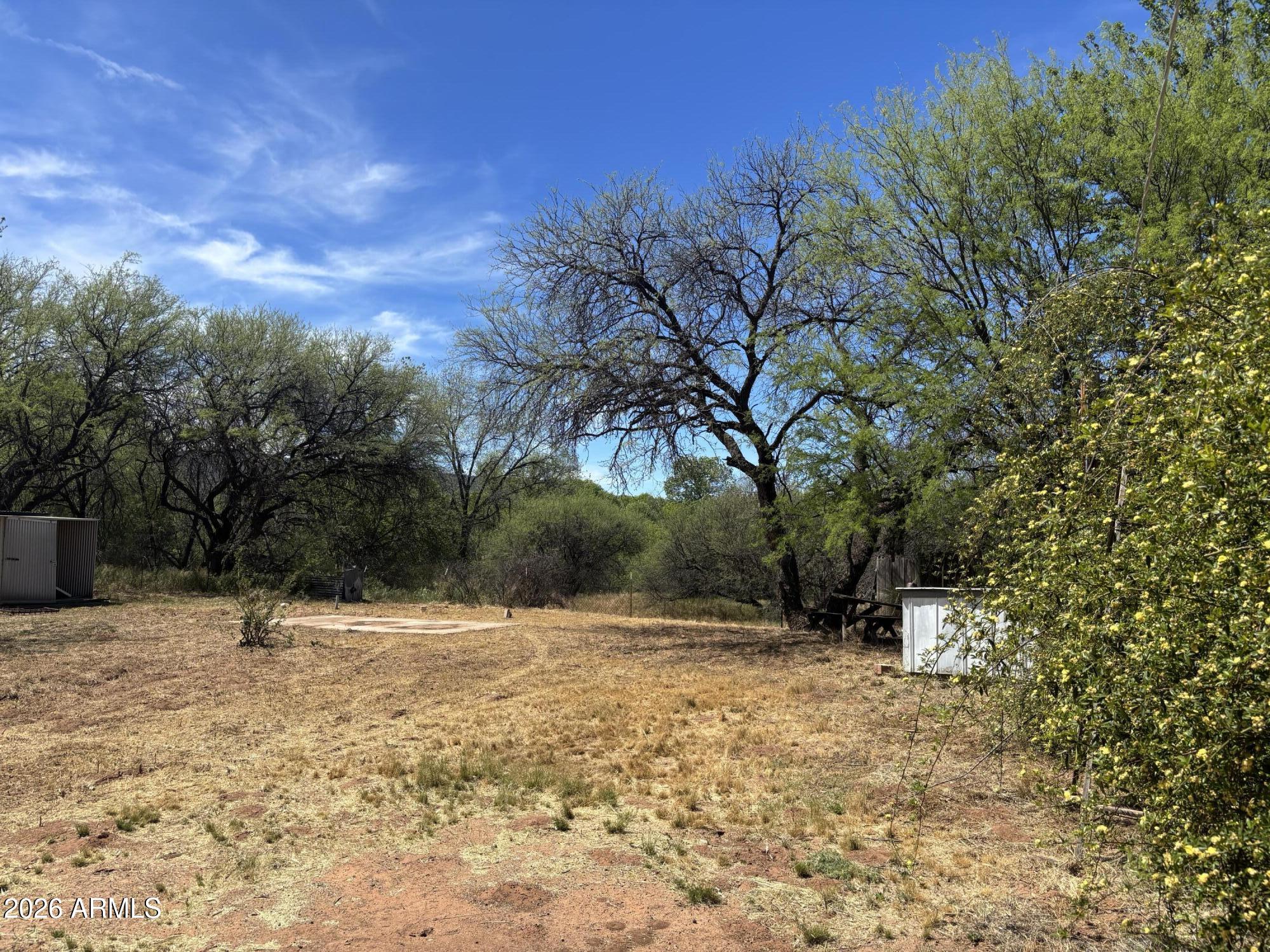 2118 North Rustler Trail, Unit 58 Camp Verde, AZ 86322 - Photo 11 of 13 a backyard of a house with lots of green space