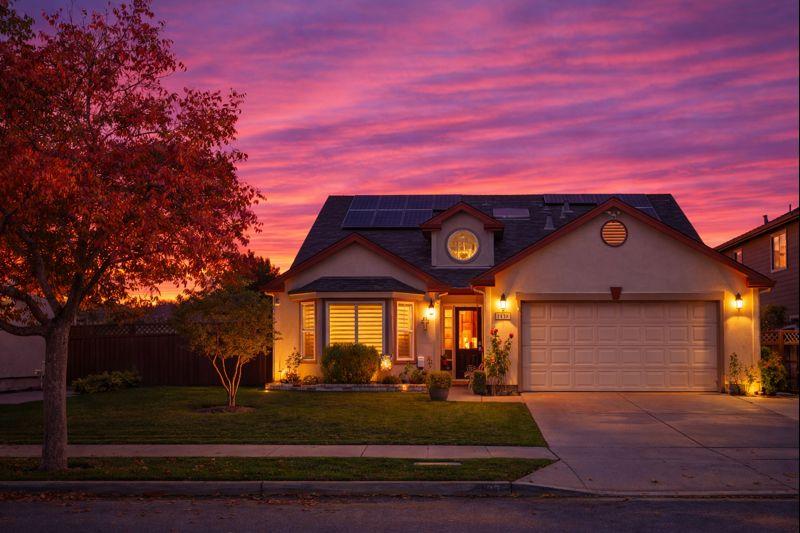 a front view of a house with garden