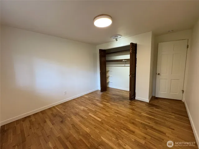 a bathroom with a granite countertop shower and a sink