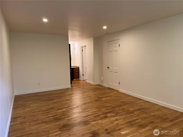 a view of walk in closet with empty racks