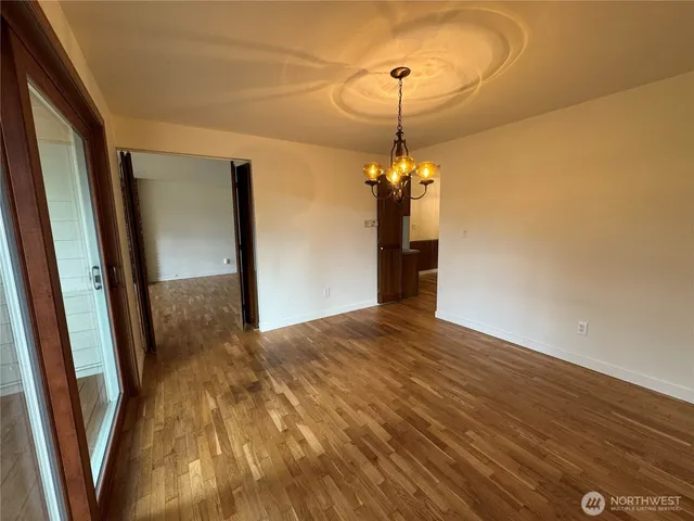 a view of a room with wooden walls