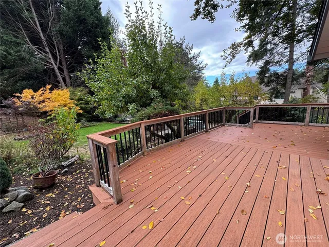 a view of a yard with furniture and a garden