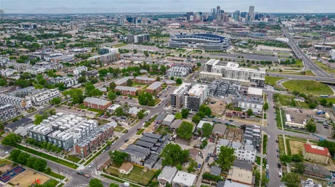 an aerial view of residential houses with outdoor space