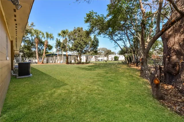 a view of a lake with a yard