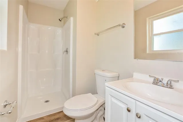 a white toilet sitting next to a bathroom sink