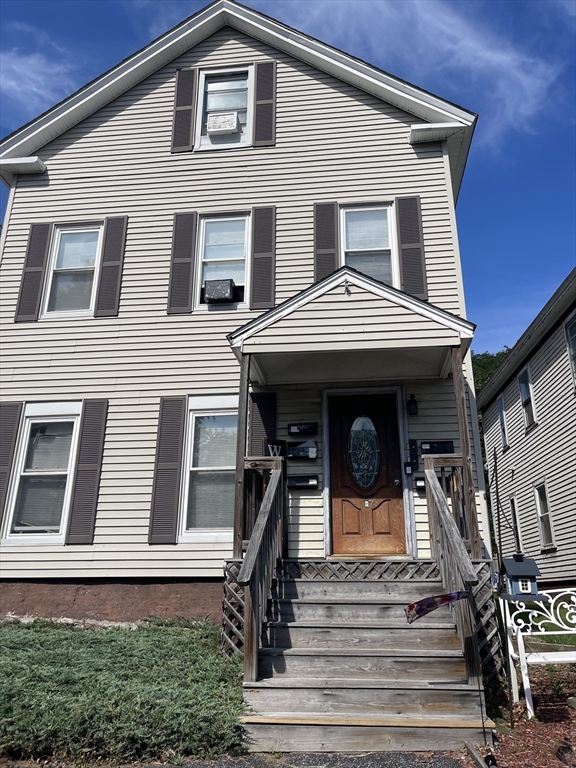 7 Buffum Street, Unit 2 Worcester, MA 01603 - Photo 1 of 23 a front view of a house with stairs