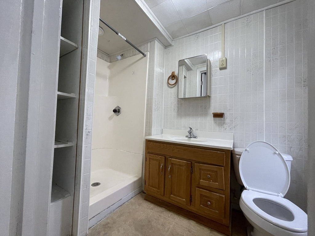 7 Buffum Street, Unit 2 Worcester, MA 01603 - Photo 12 of 23 a bathroom with a sink a toilet and shower