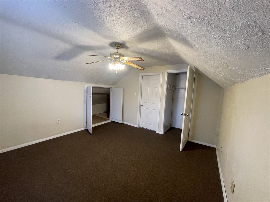 7 Buffum Street, Unit 2 Worcester, MA 01603 - Photo 20 of 23 an empty room with closet and windows