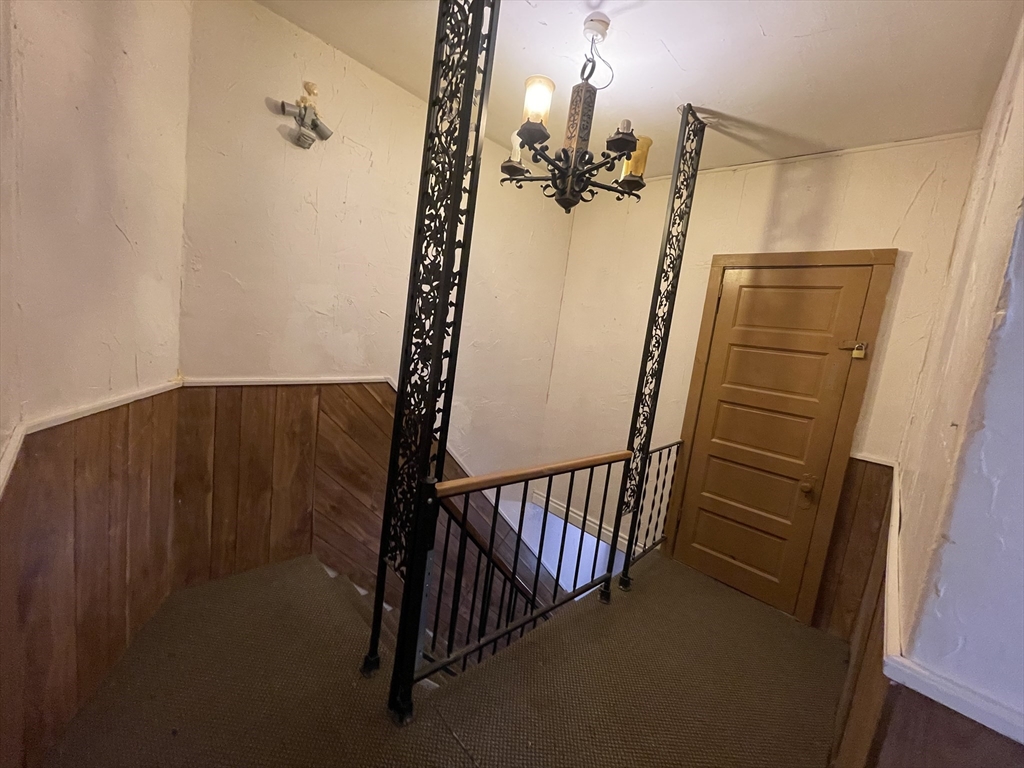 7 Buffum Street, Unit 2 Worcester, MA 01603 - Photo 21 of 23 a view of a staircase with wooden floor and staircase