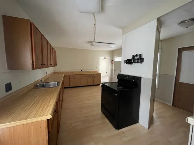 a kitchen with a stove and a refrigerator